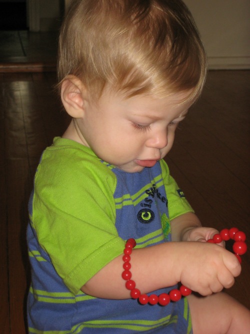 Sensitive Period for Tiny Objects - "Here the child possesses an intense interest in small, tiny objects---crumbs on the floor, threads on the couch, rocks, the beads on a necklace, etc. The child is attempting to understand, How does it all fit together? What role does it play in the whole? What's the object's purpose?"